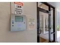 Secure building entry with telephone and security camera system at 7050 Sunset S Dr # 405, South Pasadena, FL 33707