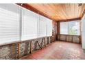 Sunroom with tiled floor and walls ready for renovation at 715 40Th Ne Ave, St Petersburg, FL 33703