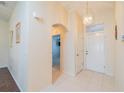 Bright and airy entryway with tile flooring and access to other rooms at 1257 Corinth Greens Dr # 1257, Sun City Center, FL 33573