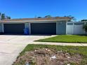Two-car garage with dark gray doors and ample space at 205 81St Ne Ave, St Petersburg, FL 33702