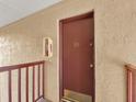 Condo entrance with a brown door and number 146 at 3869 S Lake Dr # 146, Tampa, FL 33614