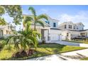 Two-story house with palm trees and a grassy lawn at 1820 47Th N Ave, St Petersburg, FL 33714