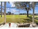 Enjoy serene golf course views from this screened porch at 31330 Spoonflower Way, Brooksville, FL 34602