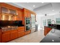 Modern kitchen with stainless steel appliances and double oven at 4404 W Azeele St, Tampa, FL 33609