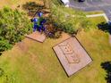Community playground with swings and climbing structures at 12610 Saulston Pl, Hudson, FL 34669
