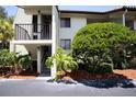 Building exterior showing entrance with landscaping at 1515 Pinellas Bayway S # 45, St Petersburg, FL 33715