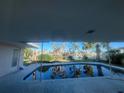 Relaxing pool area with water view, needs some TLC at 219 Leeward Is, Clearwater Beach, FL 33767