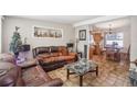 Spacious living room with leather sofas and a view of the kitchen at 401 Davison Ne Ave, St Petersburg, FL 33703