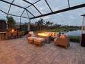 Outdoor patio with fire pit and seating area at 5011 Sandy Brook Cir, Wimauma, FL 33598