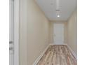 Light and airy hallway with wood-look flooring at 4522 Bay Spring Ct, Tampa, FL 33611