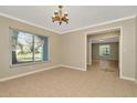 A dining room with tile floors, modern lighting and a large window at 18308 Felspar Way, Tampa, FL 33647