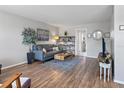 Bright living room featuring hardwood floors, comfy furniture, and a TV at 4915 Bay Ne St # 130, St Petersburg, FL 33703