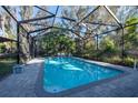 Relaxing screened pool with brick pavers at 11008 Browning Rd, Lithia, FL 33547