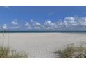 Expansive beach view with blue water and white sand at 1400 Gulf Blvd # 801, Clearwater Beach, FL 33767