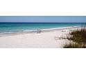 Peaceful beach scene with ocean and sand at 1400 Gulf Blvd # 801, Clearwater Beach, FL 33767