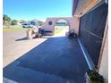 Large patio area next to the garage at 1727 Coco Palm Cir, Sun City Center, FL 33573