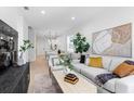 Bright living room with light gray sofa and open floor plan at 2336 W Beach St, Tampa, FL 33607