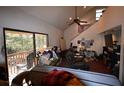 Spacious living room with high ceilings and access to a deck at 39716 Tworut Rd, Webster, FL 33597