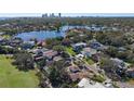 Aerial view of a waterfront property, showcasing the home's location among other houses and a golf course at 808 Monterey Ne Blvd, St Petersburg, FL 33704
