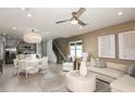 Open living and dining area with neutral colors and modern furniture at 9810 Crescent Moon Dr, Riverview, FL 33578