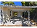 Covered carport with concrete slab and access to rear yard at 2412 38Th W Ave, Bradenton, FL 34205