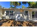 Inviting front entrance with a covered porch and decorative columns at 2412 38Th W Ave, Bradenton, FL 34205