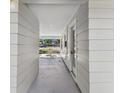 Concrete walkway connecting front and back yards at 2412 38Th W Ave, Bradenton, FL 34205