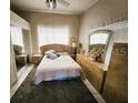 Cozy bedroom with a double bed and wood dresser at 2912 W Main St, Tampa, FL 33607