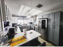 Modern kitchen featuring gray cabinets and white countertops at 2912 W Main St, Tampa, FL 33607