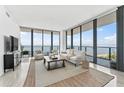Spacious living room with stunning water views and modern furnishings at 2912 W Santiago St # 404, Tampa, FL 33629