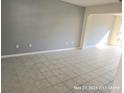 Spacious living room with tile flooring and neutral walls at 3019 Bear Oak Dr, Valrico, FL 33594