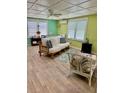 Bright living room with tiled floors and bamboo furniture at 3022 56Th S St, Gulfport, FL 33707