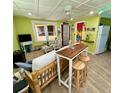 Open living space with a unique wooden bar and seating at 3022 56Th S St, Gulfport, FL 33707