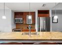 Modern kitchen with granite countertops and stainless steel appliances at 912 Channelside Dr # 2320, Tampa, FL 33602