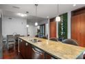 Modern kitchen with granite countertops and stainless steel appliances at 912 Channelside Dr # 2320, Tampa, FL 33602