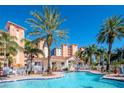 Community pool with surrounding patio and building views at 12077 Gandy N Blvd # 374, St Petersburg, FL 33702
