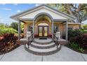 Inviting brick home entry with a tiered front porch at 3220 W Bay Vista Ave, Tampa, FL 33611