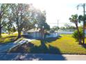 Single story home with a spacious yard and mature trees at 212 Francis Dr, Apollo Beach, FL 33572