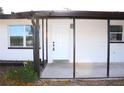 Front entrance with covered porch and screened enclosure at 212 Francis Dr, Apollo Beach, FL 33572