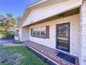 Front view of a ranch house featuring a brick facade and walkway at 4510 W Mcelroy Ave, Tampa, FL 33611