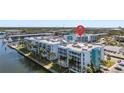 Aerial view showing building location, waterfront, and nearby amenities at 4900 38Th S Way # 305, St Petersburg, FL 33711