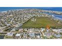 Wide aerial showcasing the property's waterfront location and neighborhood at 514 77Th St, Holmes Beach, FL 34217