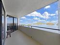 Enjoy the scenic water views from this condo's private balcony with black metal railing at 5915 Sea Ranch Dr # 408, Hudson, FL 34667