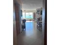 View from entryway into dining room, featuring a table and water view at 6020 Shore S Blvd # 301, Gulfport, FL 33707