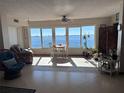 Bright living room with water views and comfortable seating at 6020 Shore S Blvd # 301, Gulfport, FL 33707