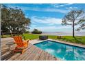 Inviting pool and deck area overlooking the calm waters at 750 71St S Ter, St Petersburg, FL 33705