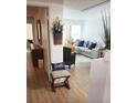 Inviting entryway with view of living room and hardwood floors at 9950 47Th N Ave # 104, St Petersburg, FL 33708