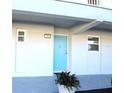 Building exterior showcasing a light blue door at 9950 47Th N Ave # 104, St Petersburg, FL 33708