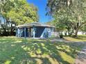 Recently remodeled blue house with a spacious yard at 1719 E Cayuga St, Tampa, FL 33610