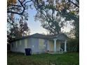 Small house with boarded windows, needs renovation at 1920 W Saint John St, Tampa, FL 33607